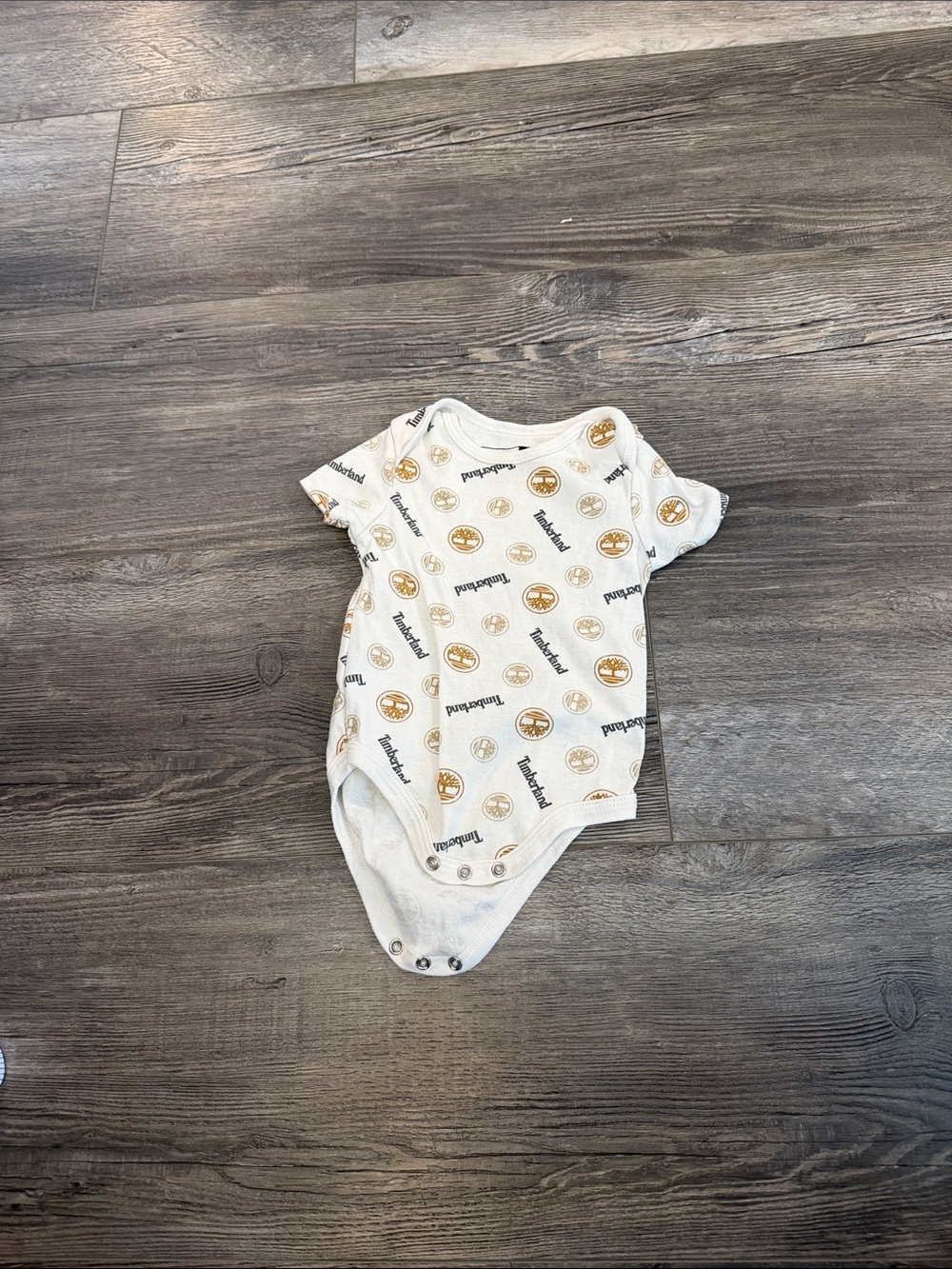 Timberland White Bodysuit with Tan Logo Print